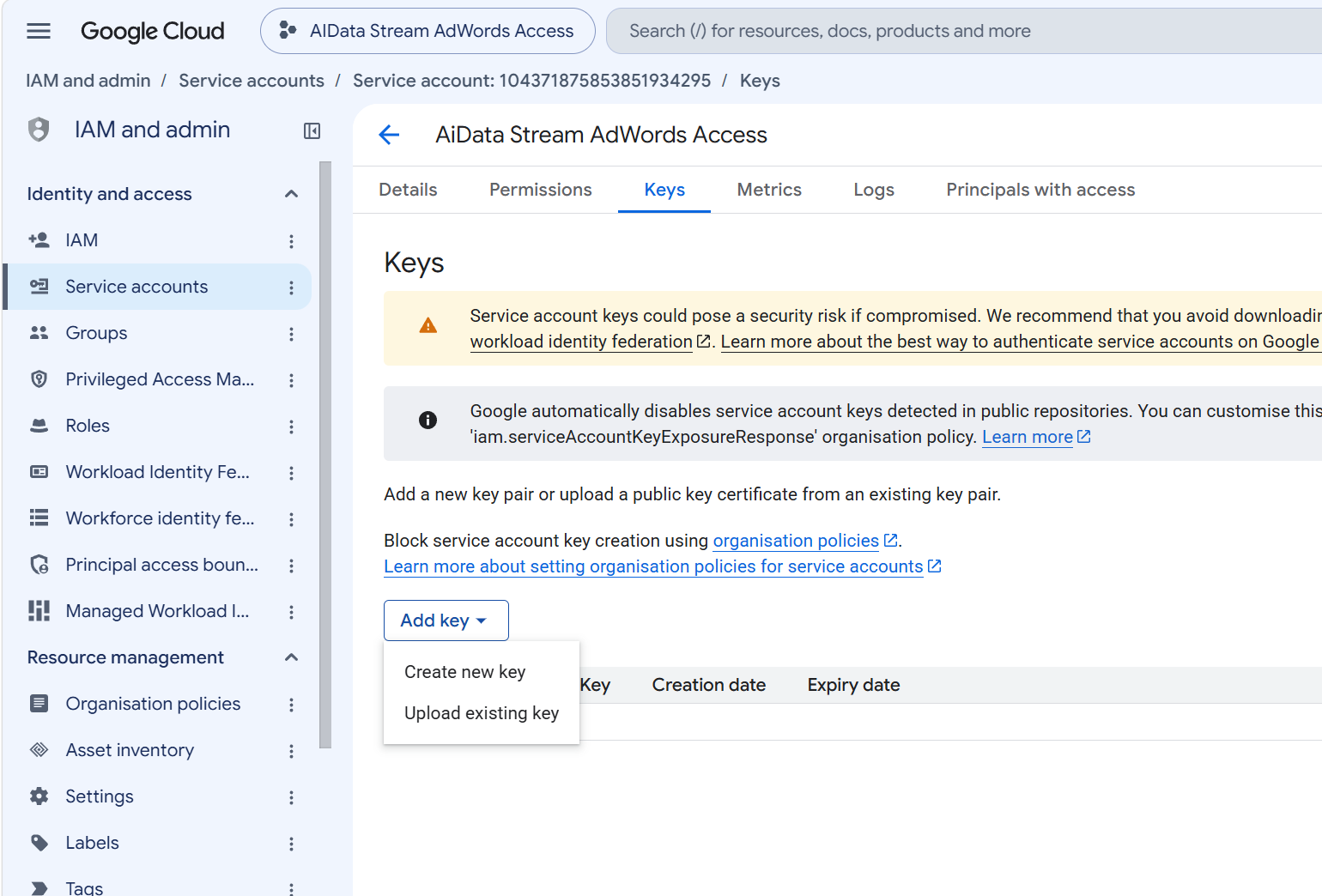 The service account Keys tab with the Add key menu open showing Create new key