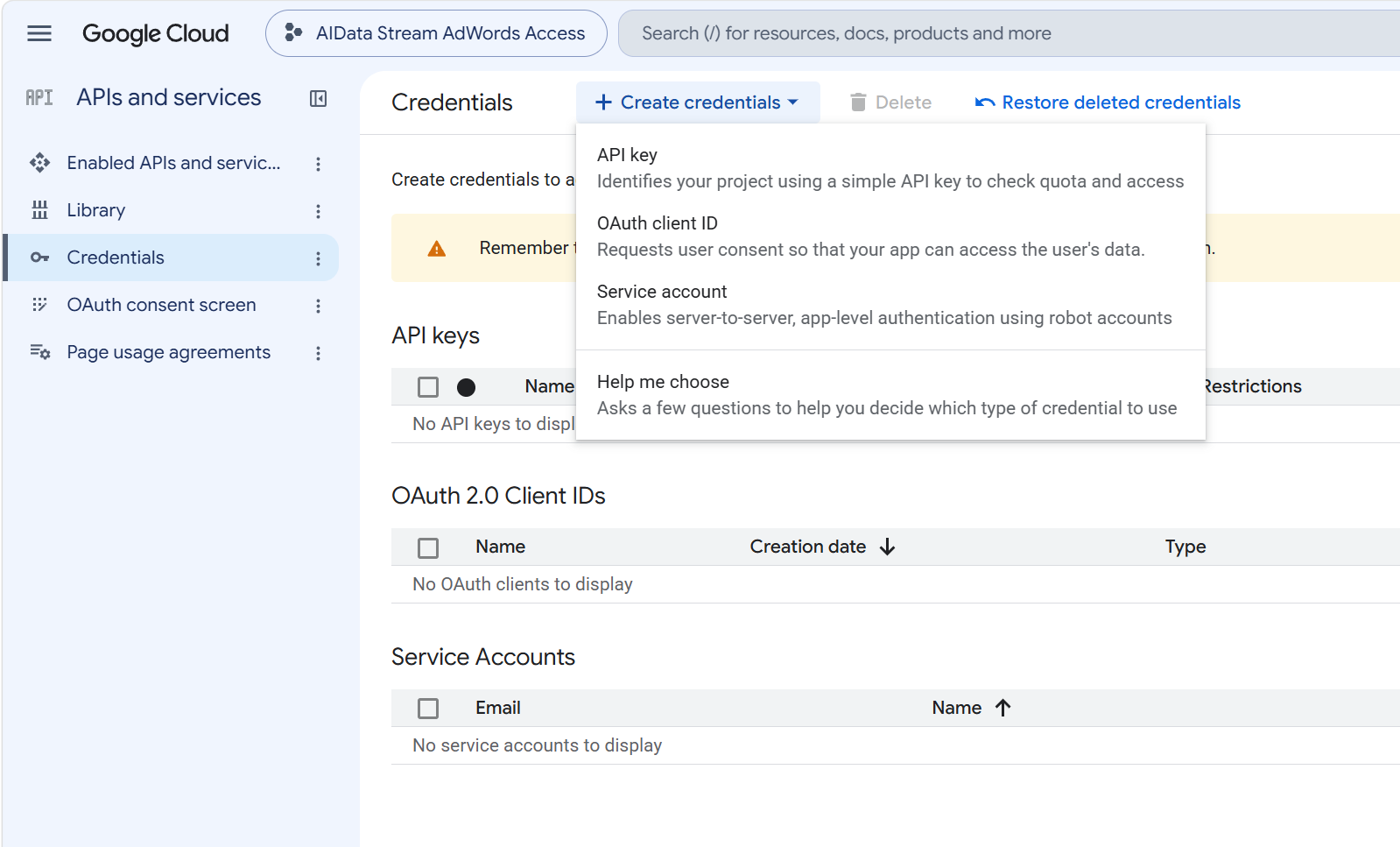 The Create credentials menu in Google Cloud open, with the Service account option listed under API key and OAuth client ID
